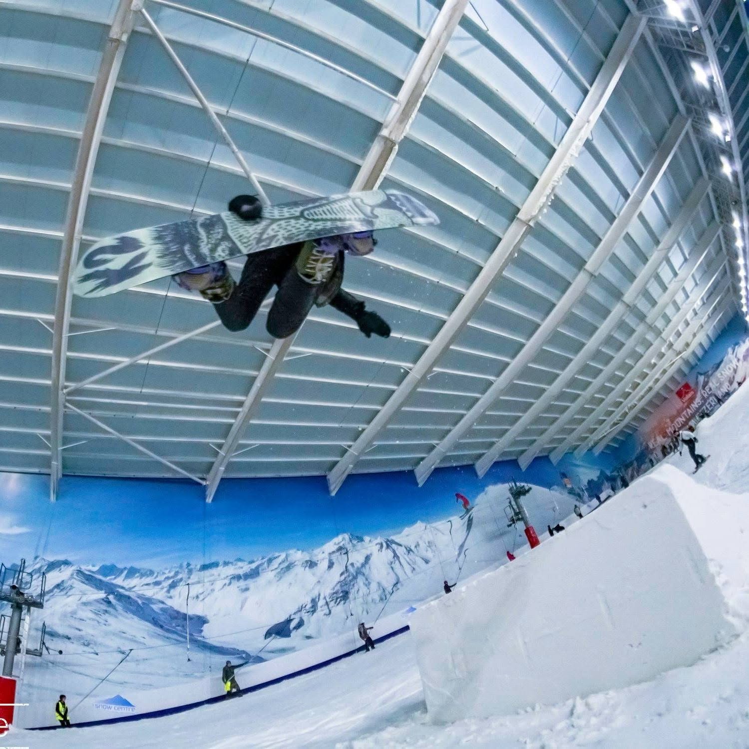 Skier on a rail feature at the park